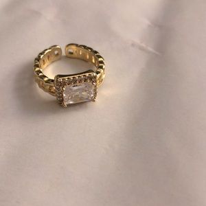 Gold tone adjustable clear stone ring